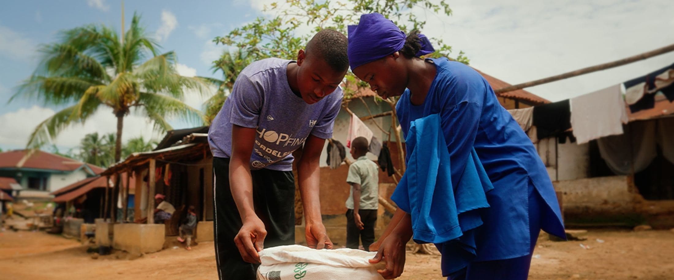 Collecting water at a stream, Sierra Leone