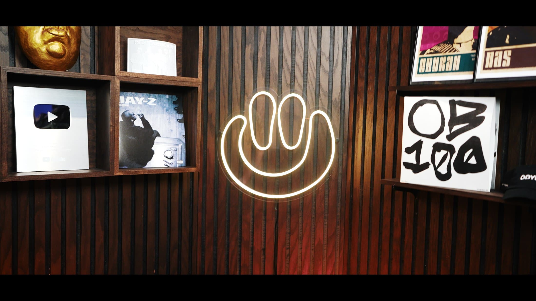 Studio set detail, neon sign and record shelf