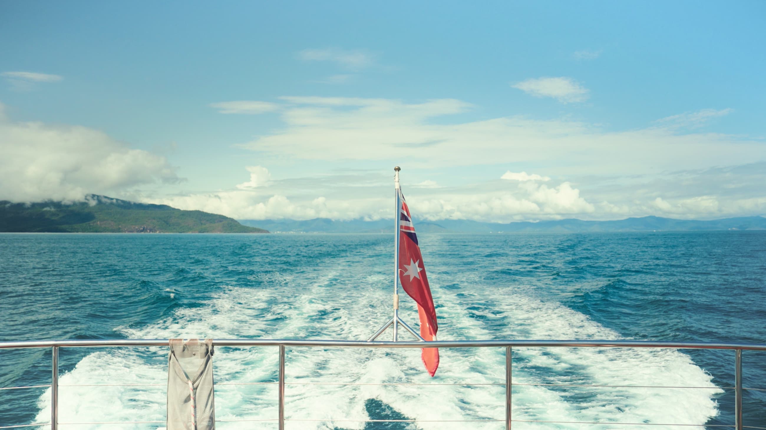The Australian red ensign flying from the stern of a research boat