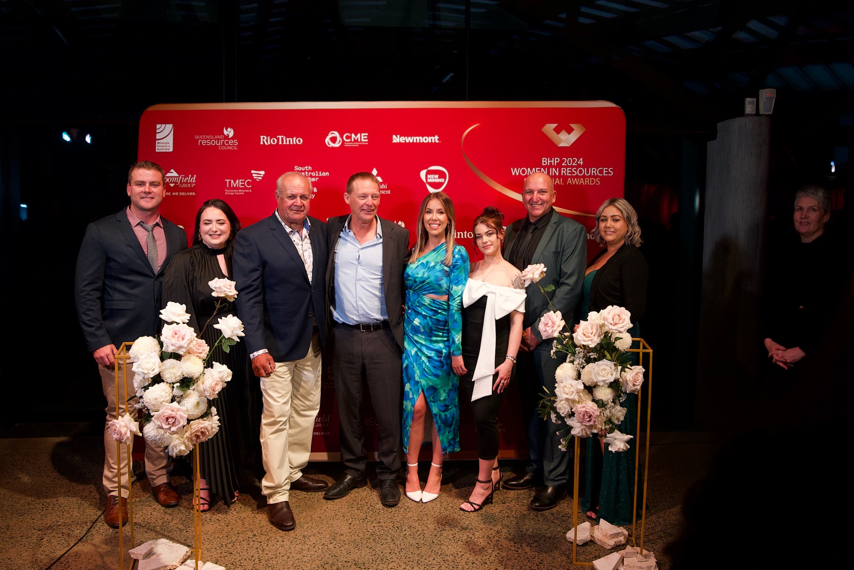 Group photo in front of the awards step-and-repeat