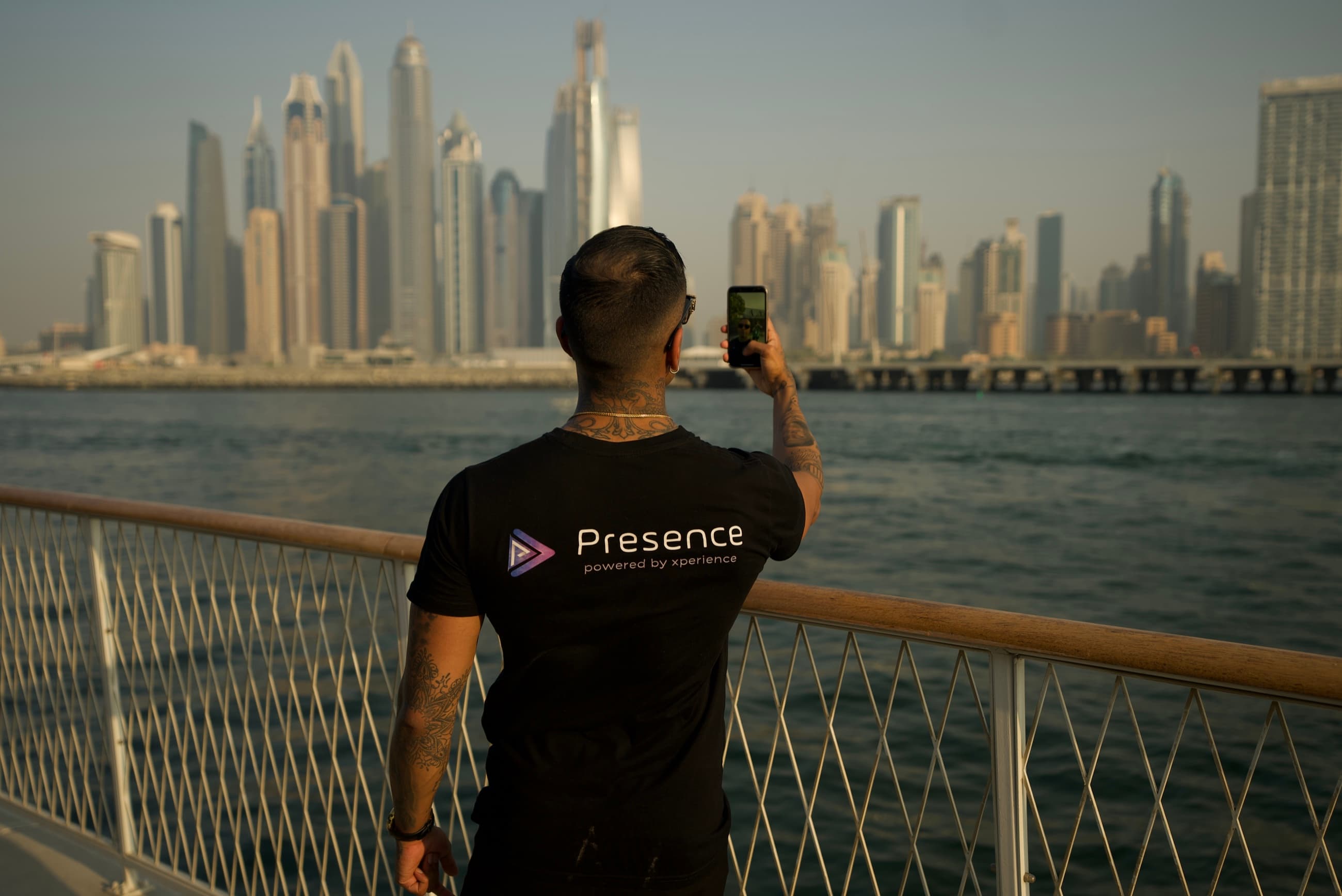 A Presence team member looking out over Dubai Marina