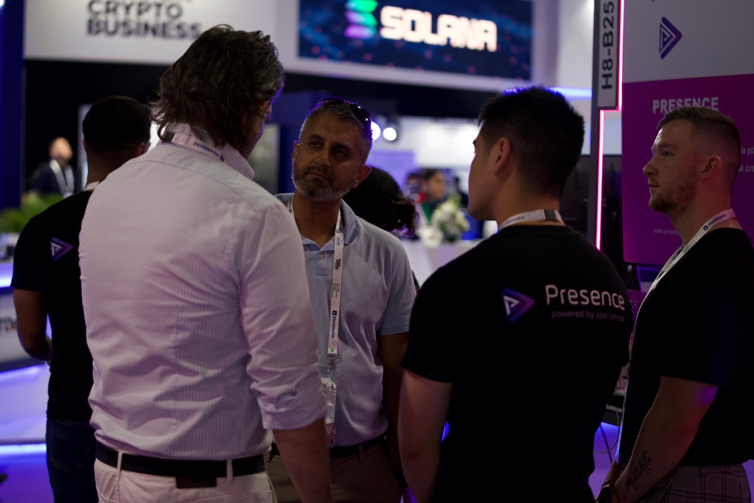 Delegates in conversation at the Presence booth