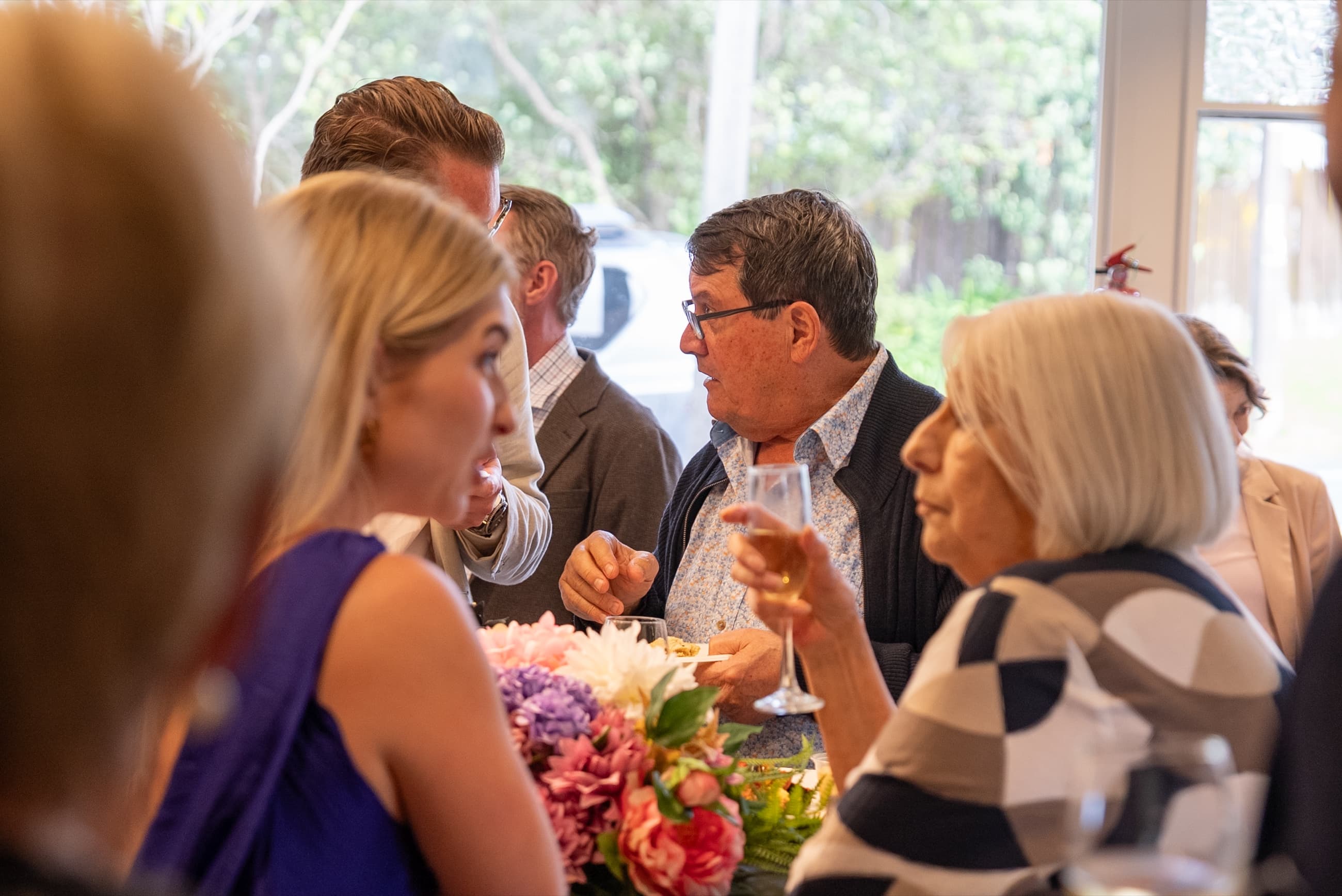 Guests laughing together at the launch night event