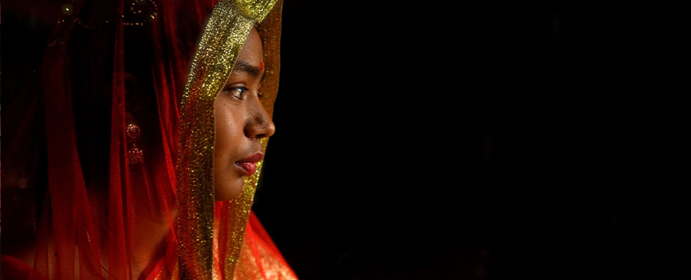 Portrait of a girl in a red veil, Bangladesh