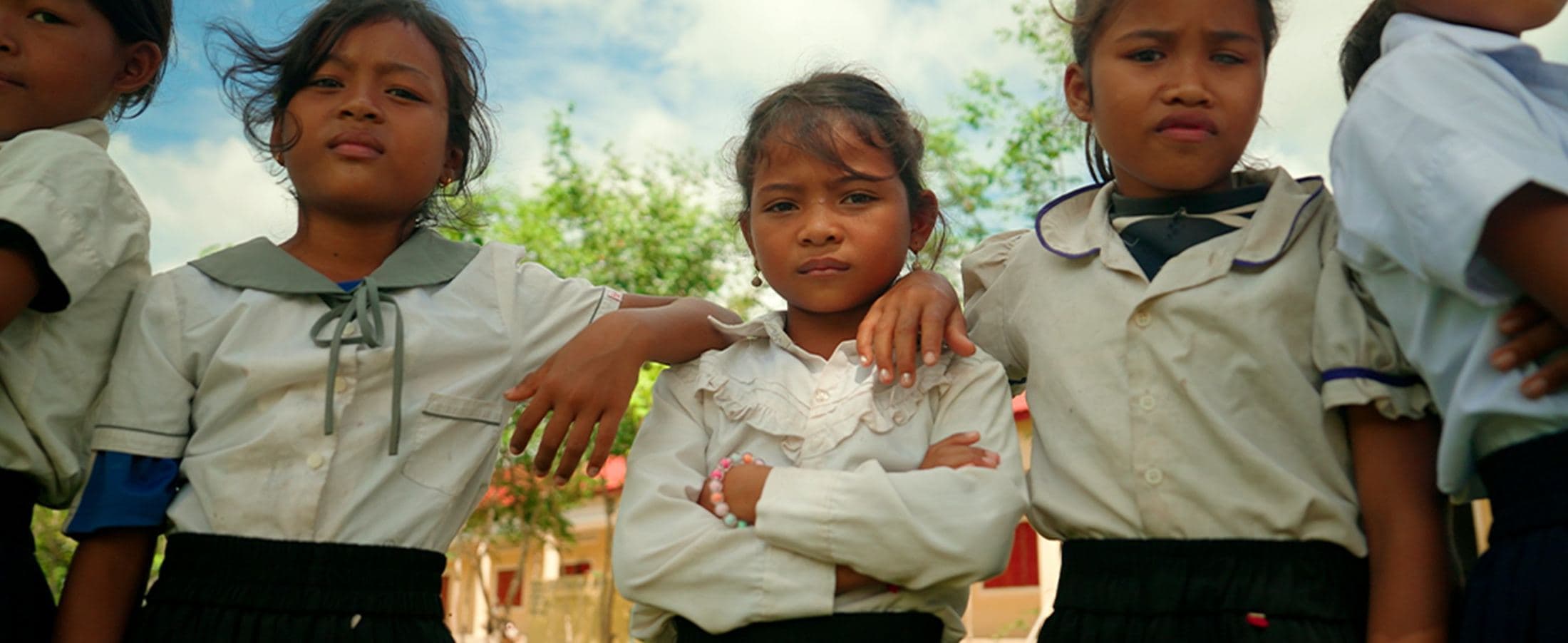 Three schoolgirls in uniform, Cambodia
