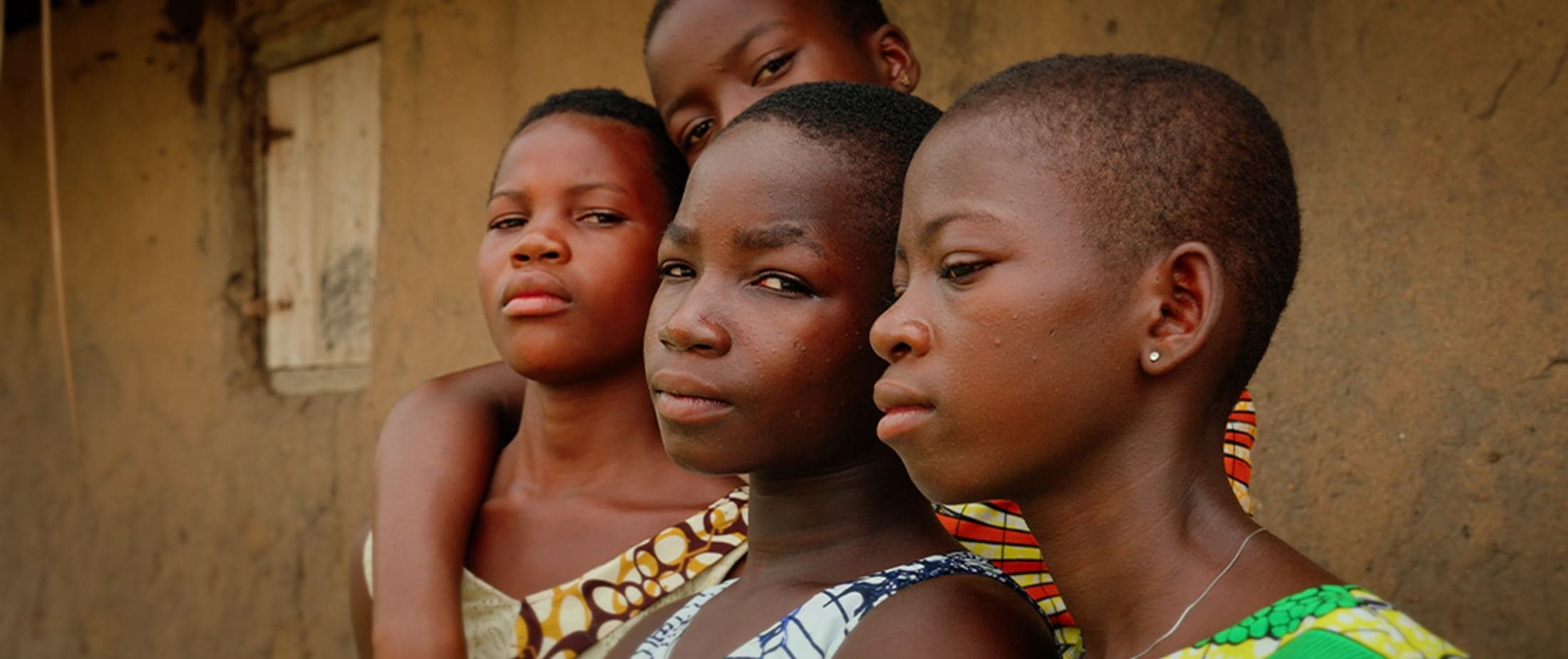 Three girls in traditional dress, Ghana