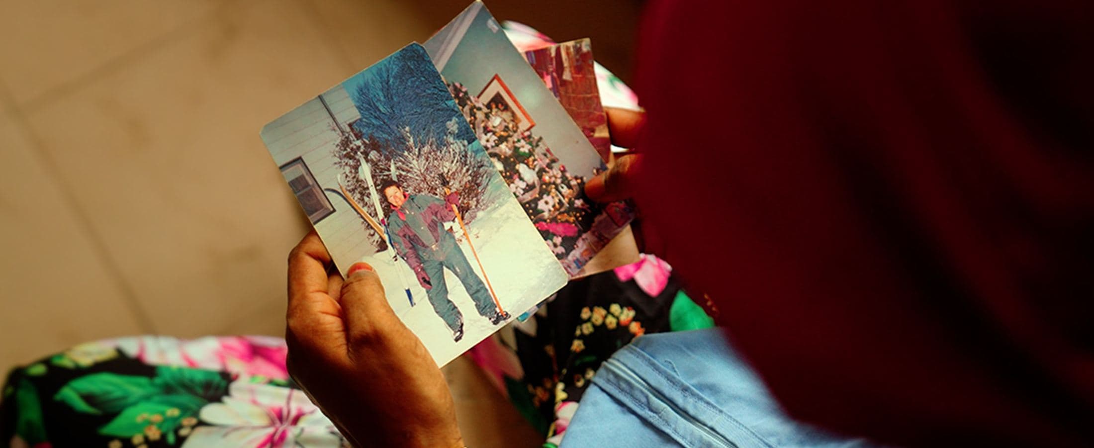 Woman looking at an old photograph, Senegal
