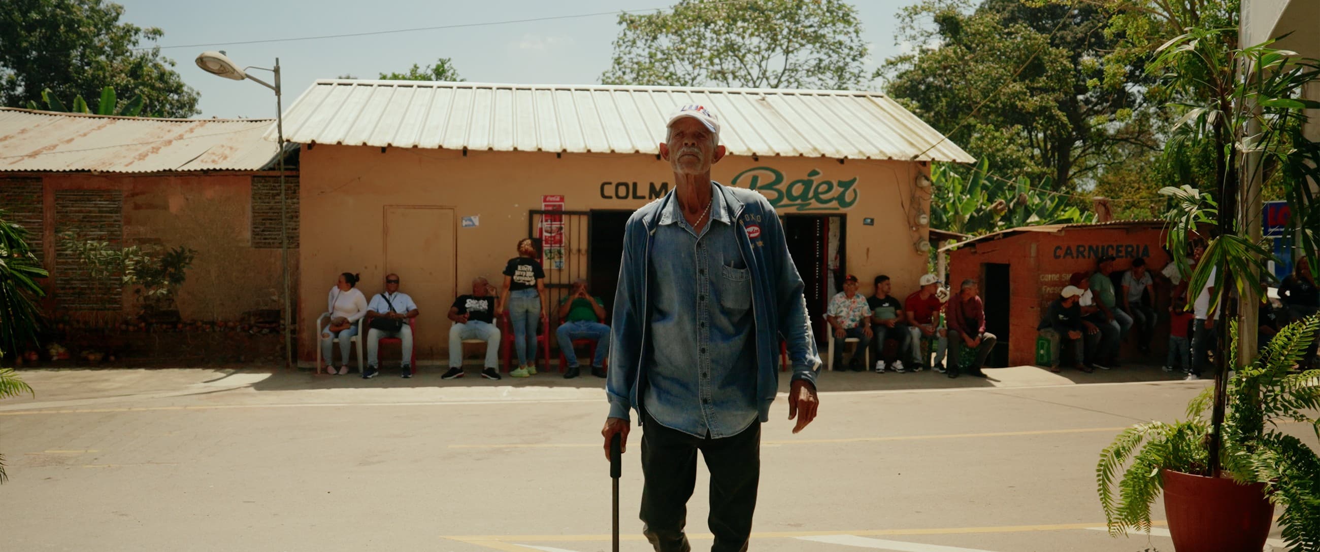 A local man in front of a corner store
